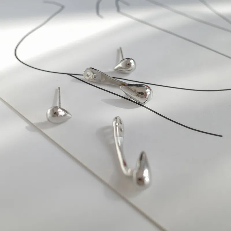 Silberne Ohrringe Set, minimalistisches Design, Tropfenform, Schmuck für Damen, modern.