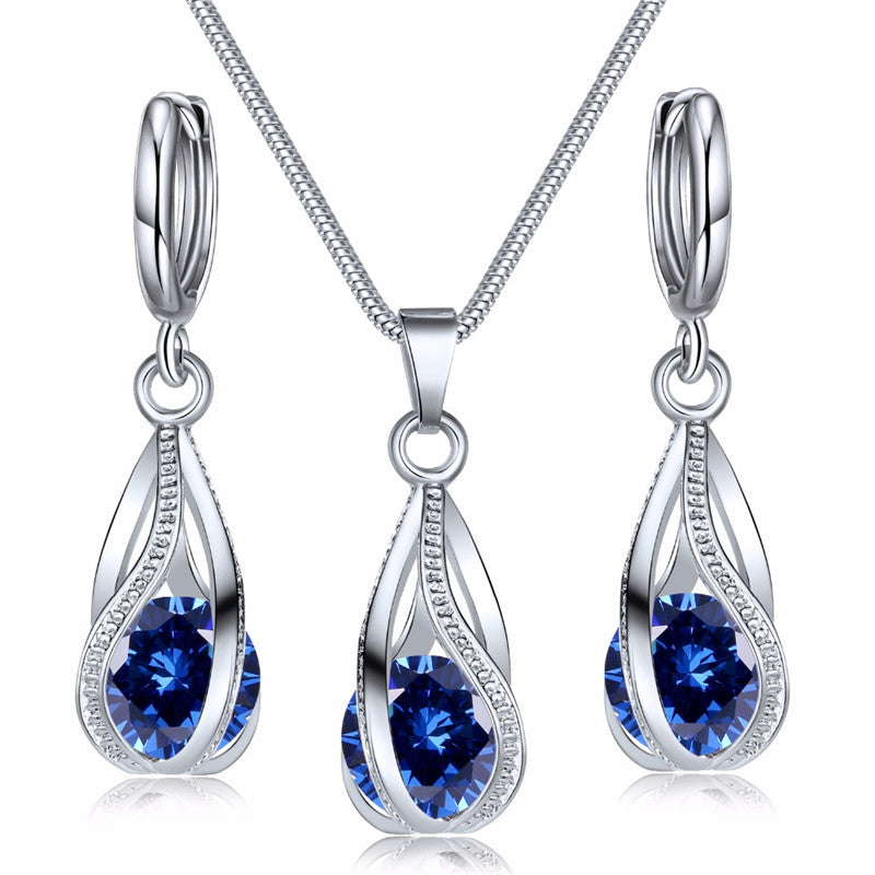 Silberne Halskette und Ohrringe Set mit blauen Zirkonia, eleganter Schmuck für Frauen.