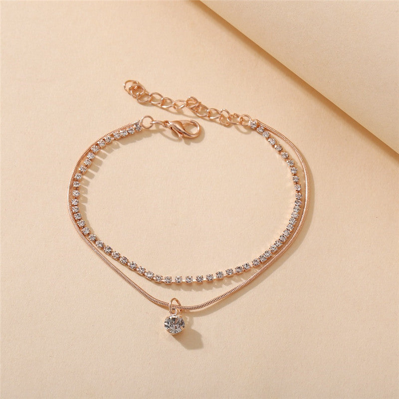Goldene Boho-Fußkette mit Zirkonia, zweireihig, Damen-Schmuck, verstellbar.