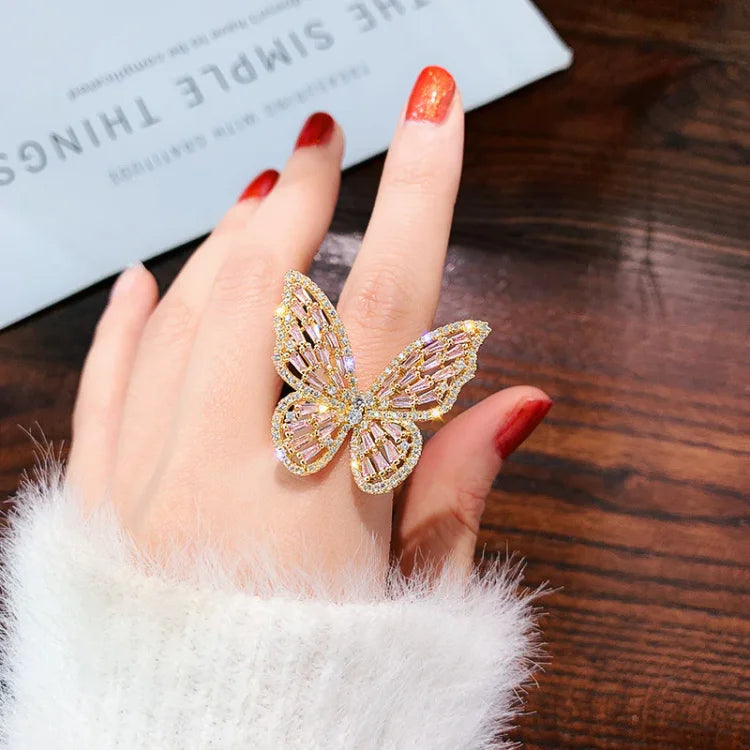 Schmetterlingsring Damen, goldfarben, Strass, elegantes Design, modischer Schmuck, Geschenkidee.