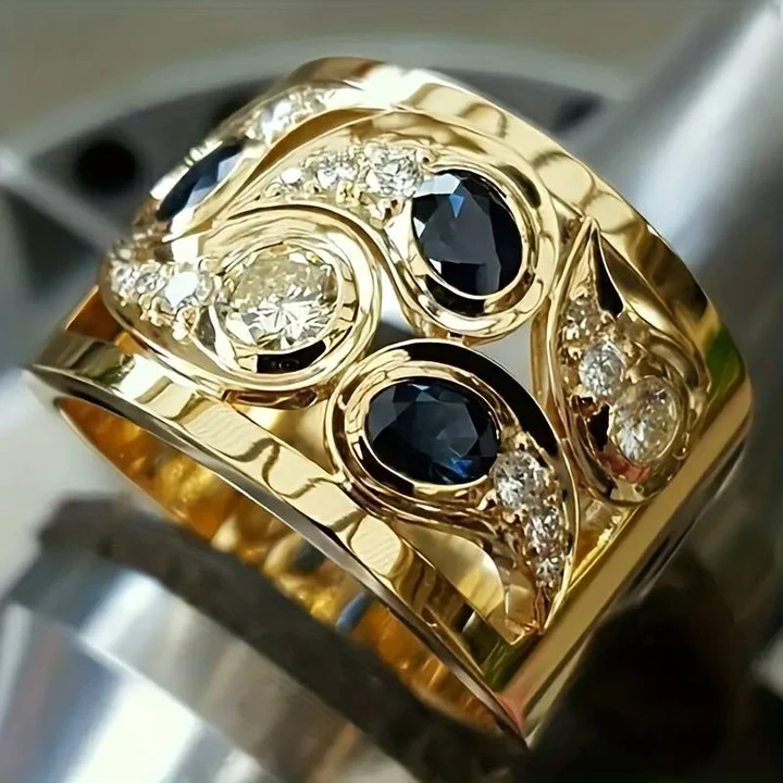 Goldener Ring mit blauen Saphiren und Diamanten, luxuriöses Schmuckdesign, glänzend.