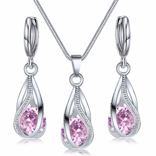 Silberne Halskette und Ohrringe Set mit rosa Zirkonia, eleganter Schmuck für Frauen.