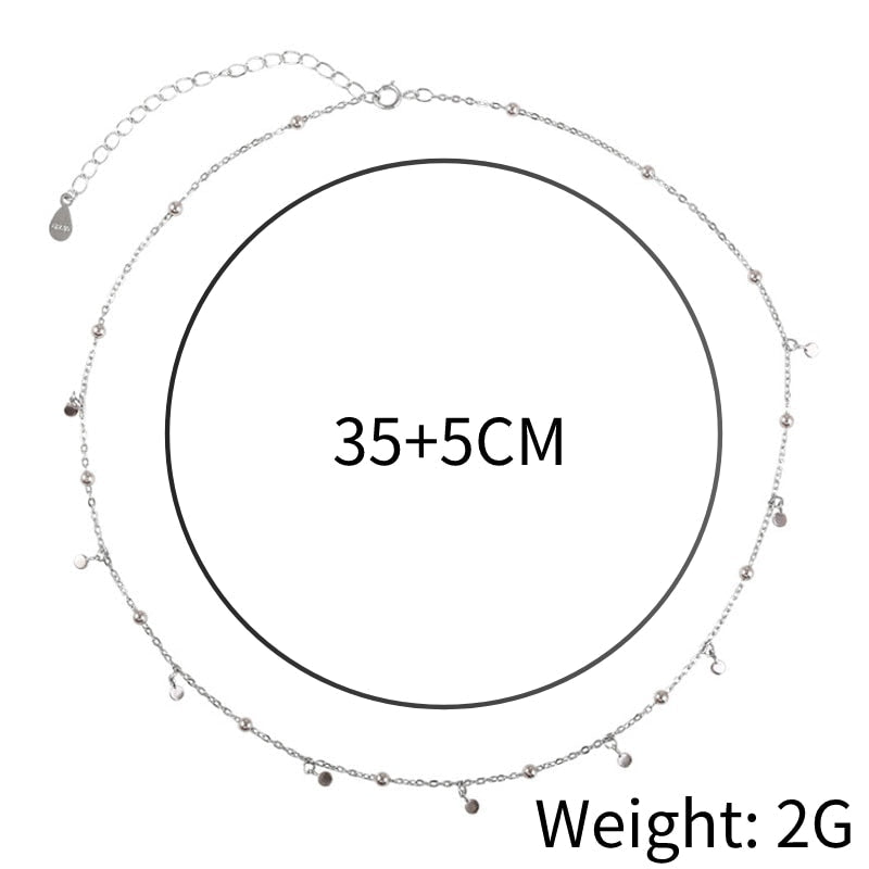 Silberne Halskette mit kleinen Anhängern, verstellbar 35+5 cm, Gewicht 2g, elegantes Schmuckdesign.
