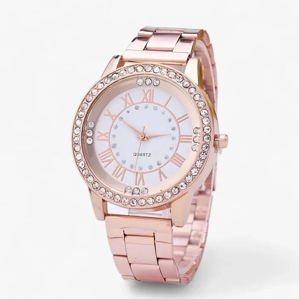 Roségoldene Damenarmbanduhr mit Strasssteinen, römischen Ziffern und Metallarmband.