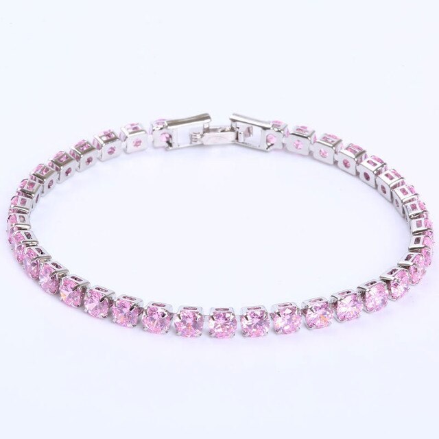 Silbernes Armband mit rosa Kristallen, elegantes Schmuckstück, funkelndes Design.