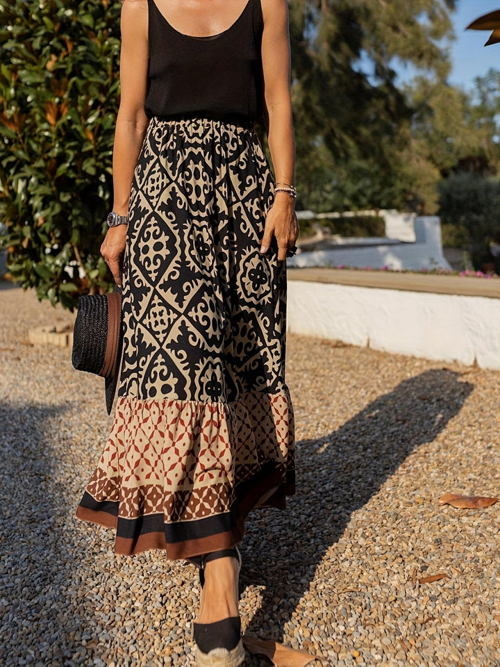 Printet boho maxi-nederdel med flydende snit og frynser – Yalina
