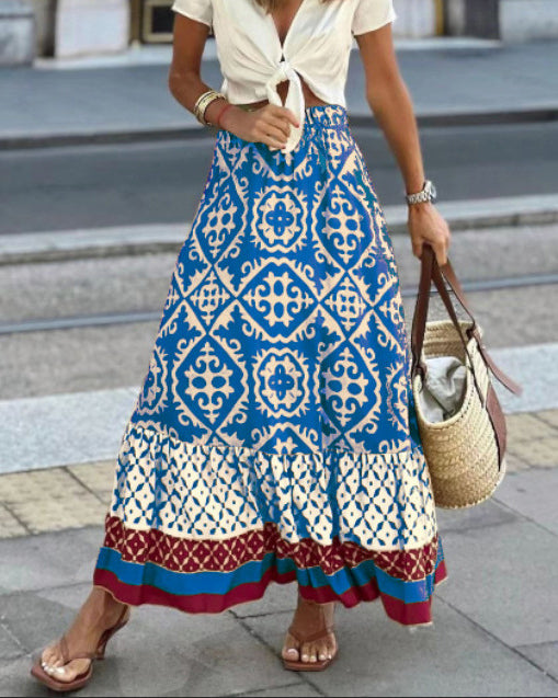 Printet boho maxi-nederdel med flydende snit og frynser – Yalina
