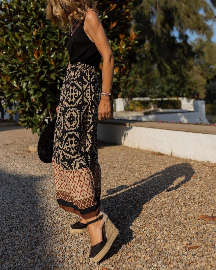 Printet boho maxi-nederdel med flydende snit og frynser – Yalina