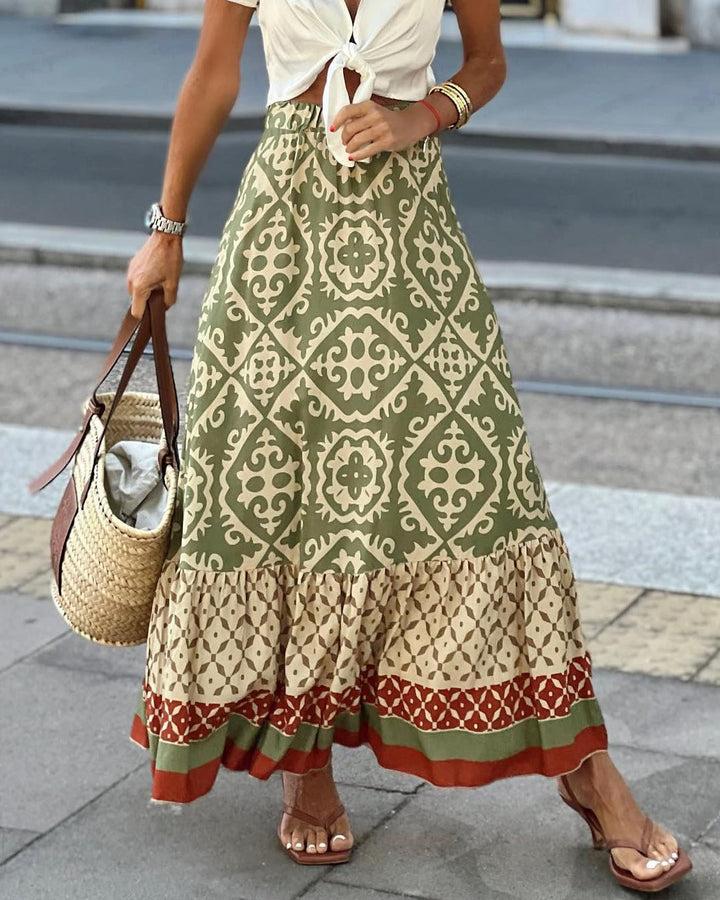 Printet boho maxi-nederdel med flydende snit og frynser – Yalina