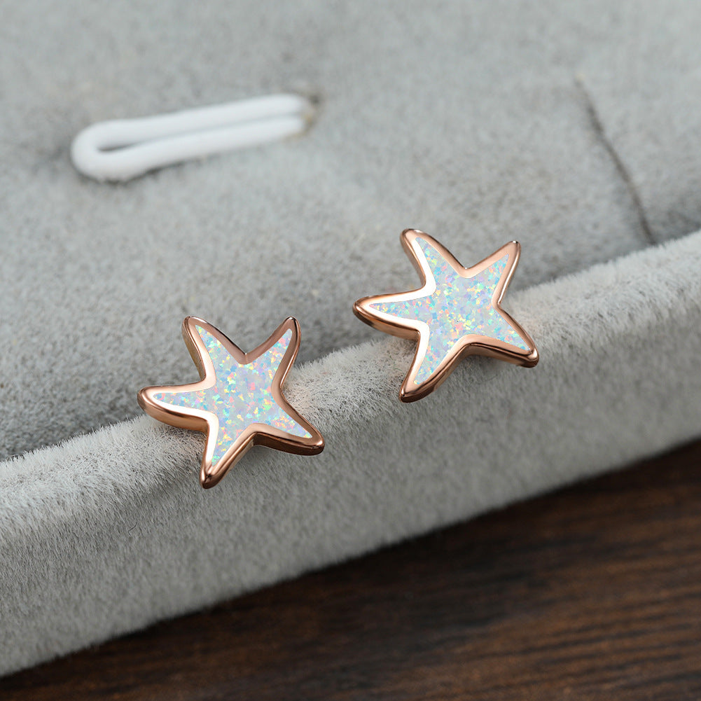Sternförmige Ohrringe, Roségold, Opal-Effekt, Schmuck, modisch, Damenaccessoire, Geschenkidee.