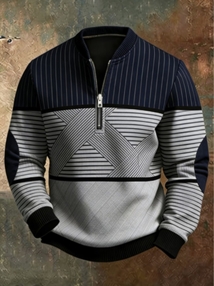 Sweater med halv lynlås i marineblå og lysegrå med blandede striber, ribkant og mørke albuepatches, set forfra. 1