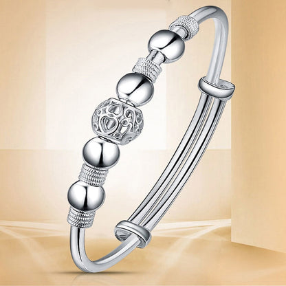 Silberarmband mit Kugel- und Musterdesign, eleganter Schmuck, Damenaccessoire, Geschenkidee.