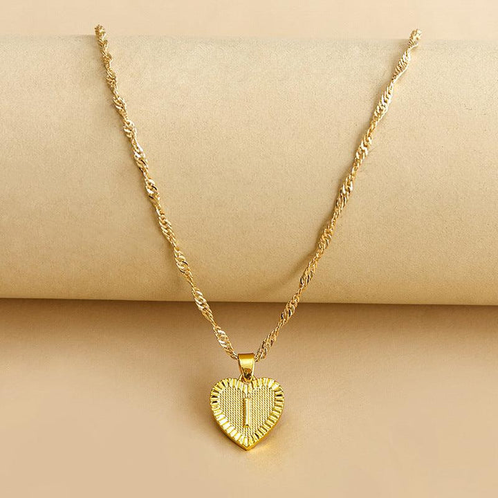 Goldene Herz-Halskette mit gedrehtem Kettenmuster, eleganter Schmuck für Damen.