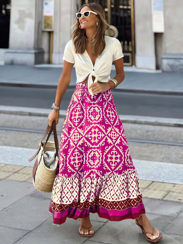 Printet boho maxi-nederdel med flydende snit og frynser – Yalina