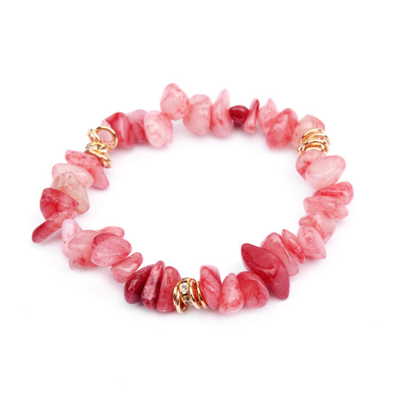 Rosa Edelstein-Armband mit goldenen Akzenten, handgefertigt, modisches Schmuckstück.