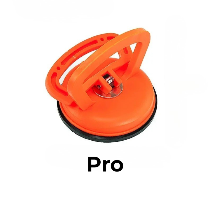 Stor orange sugekop med sort gummikant og blank metalskive i midten, vist alene på hvid baggrund. 7