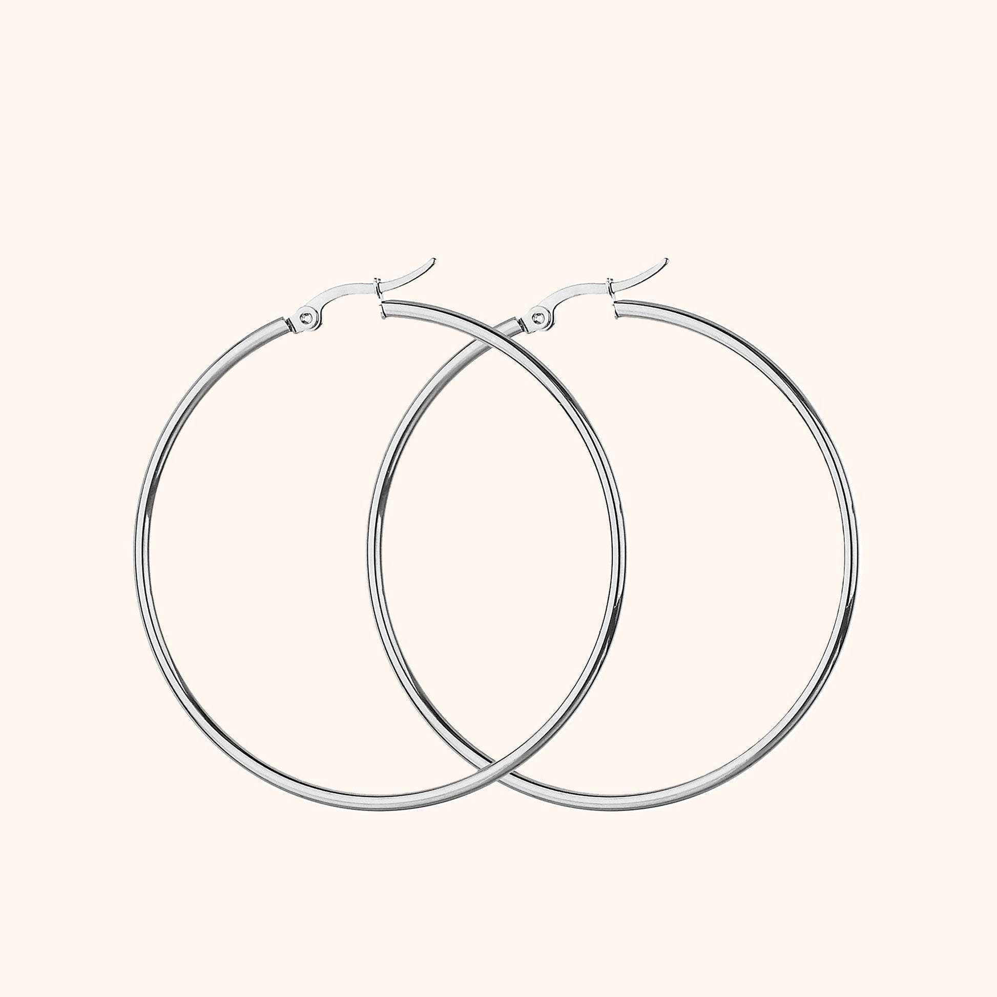 Silberne Creolen Ohrringe, Edelstahl, minimalistisches Design, modischer Schmuck für Damen.