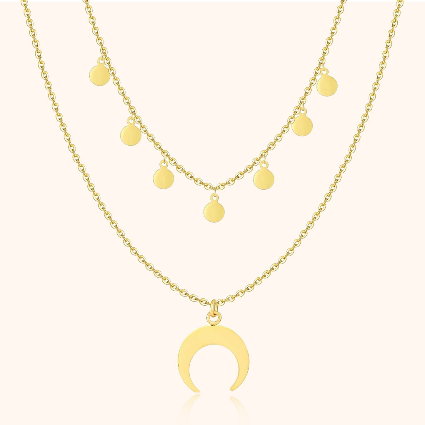 Goldene Halskette mit Halbmond-Anhänger und runden Anhängern, modischer Schmuck.