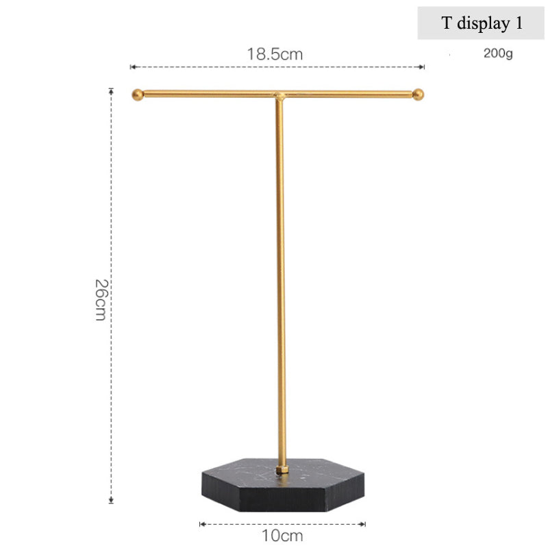 Goldener T-förmiger Schmuckständer aus Metall mit schwarzem Sockel, ideal für Ohrringe.