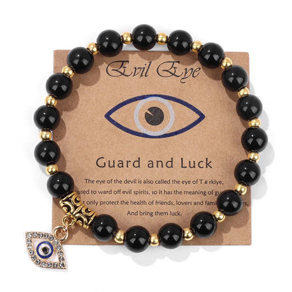 Schwarzes Onyx-Armband mit goldenen Perlen und Nazar-Anhänger, Schutz und Glück.