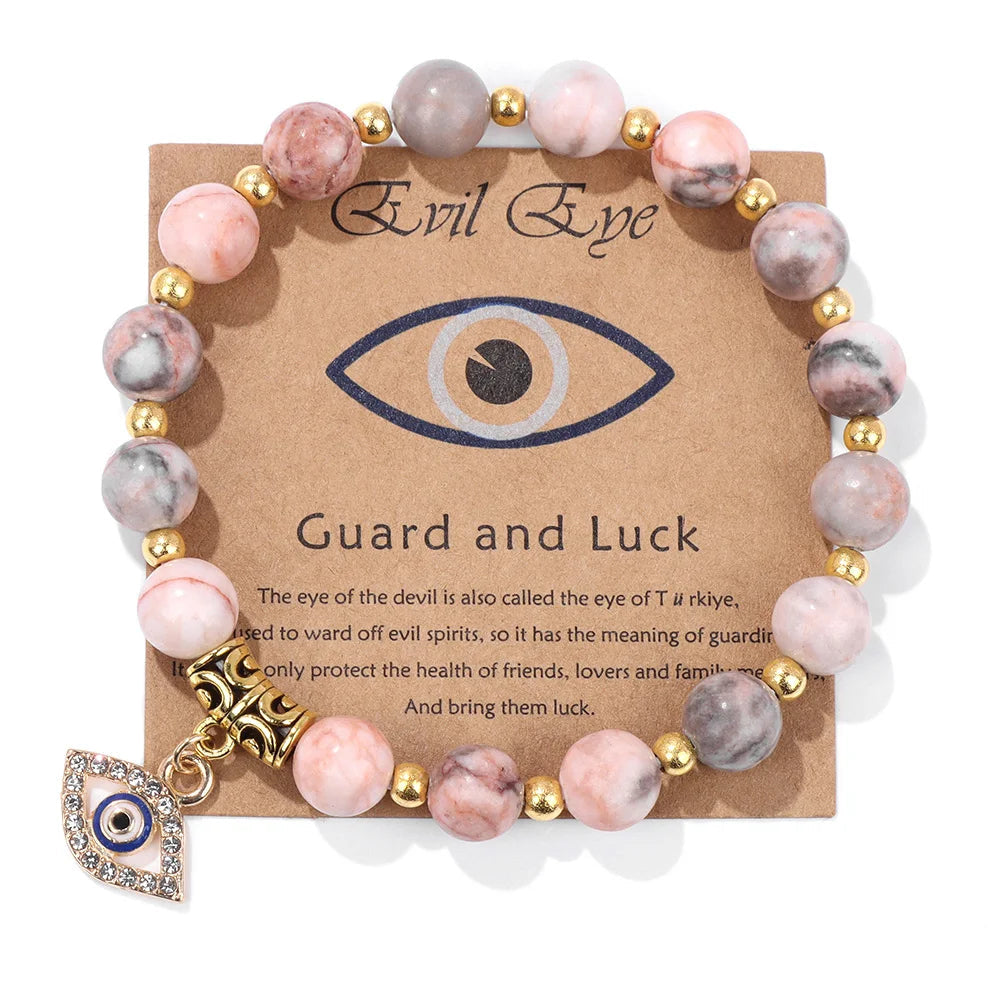 Rosa Zebra Jaspis Armband mit goldenen Perlen und bösem Auge Anhänger, Schutz und Glück.
