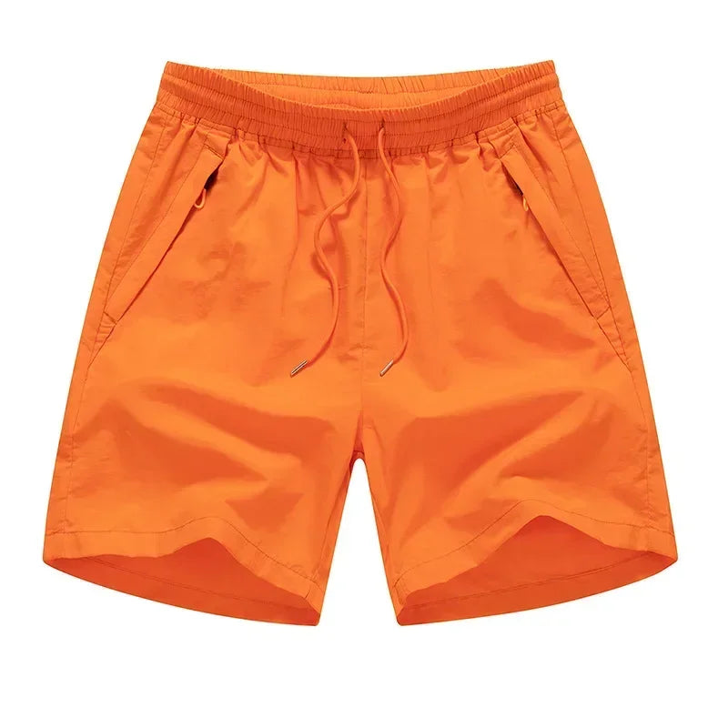 Løbeshorts til herrer med mesh-indershorts og lommer med lynlås – Nikoas