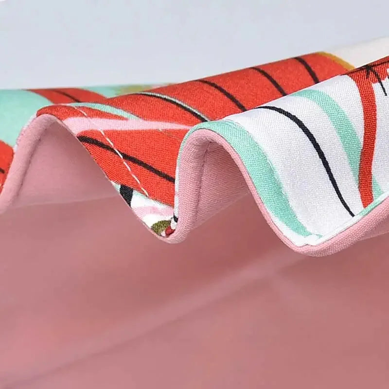 Vendbar solhat i bomuld med bred skyggekant (56–60 cm) – Liora