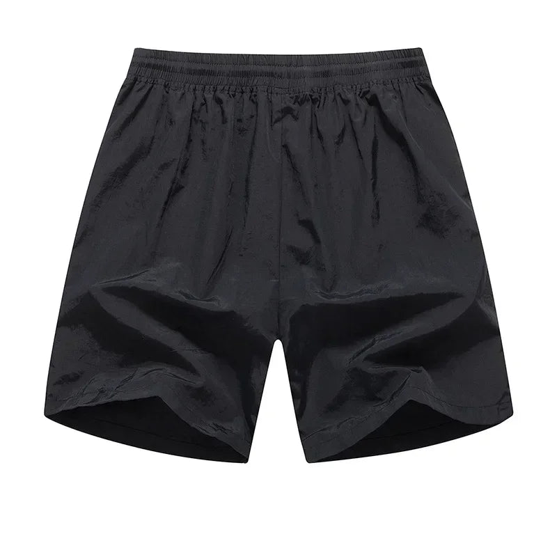 Løbeshorts til herrer med mesh-indershorts og lommer med lynlås – Nikoas