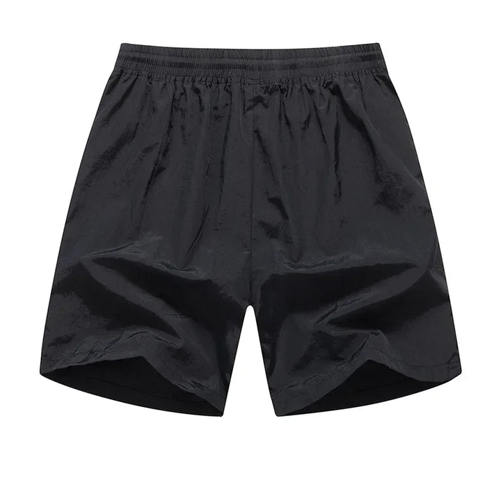 Løbeshorts til herrer med mesh-indershorts og lommer med lynlås – Nikoas