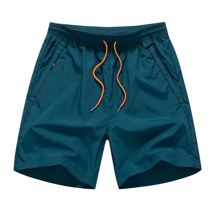 Løbeshorts til herrer med mesh-indershorts og lommer med lynlås – Nikoas