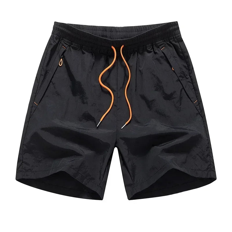 Løbeshorts til herrer med mesh-indershorts og lommer med lynlås – Nikoas