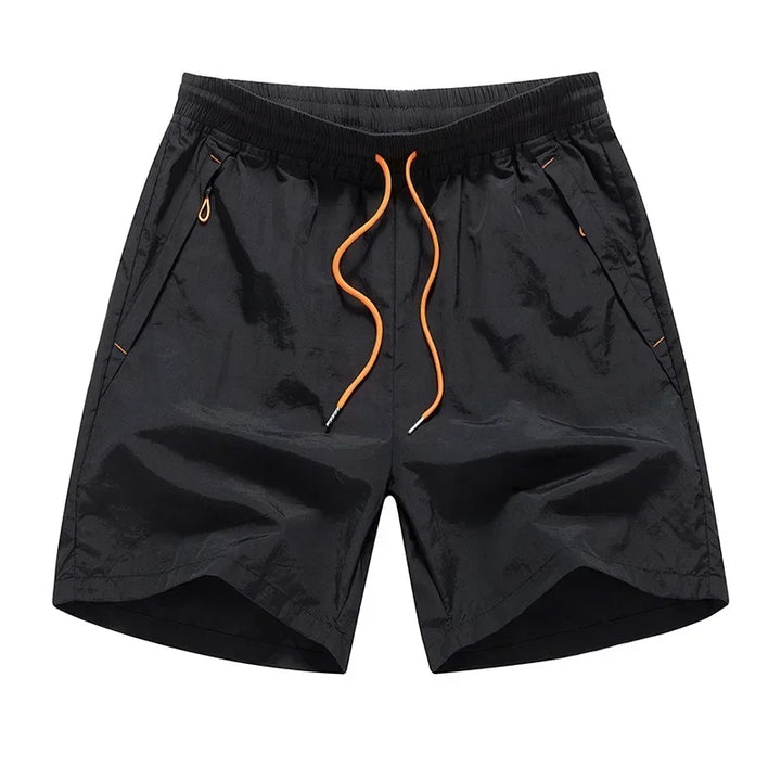 Løbeshorts til herrer med mesh-indershorts og lommer med lynlås – Nikoas
