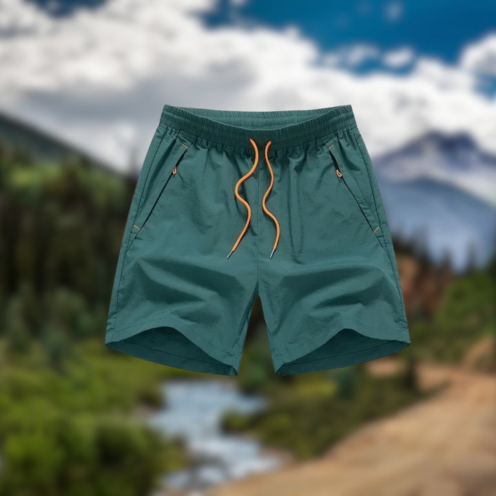 Løbeshorts til herrer med mesh-indershorts og lommer med lynlås – Nikoas
