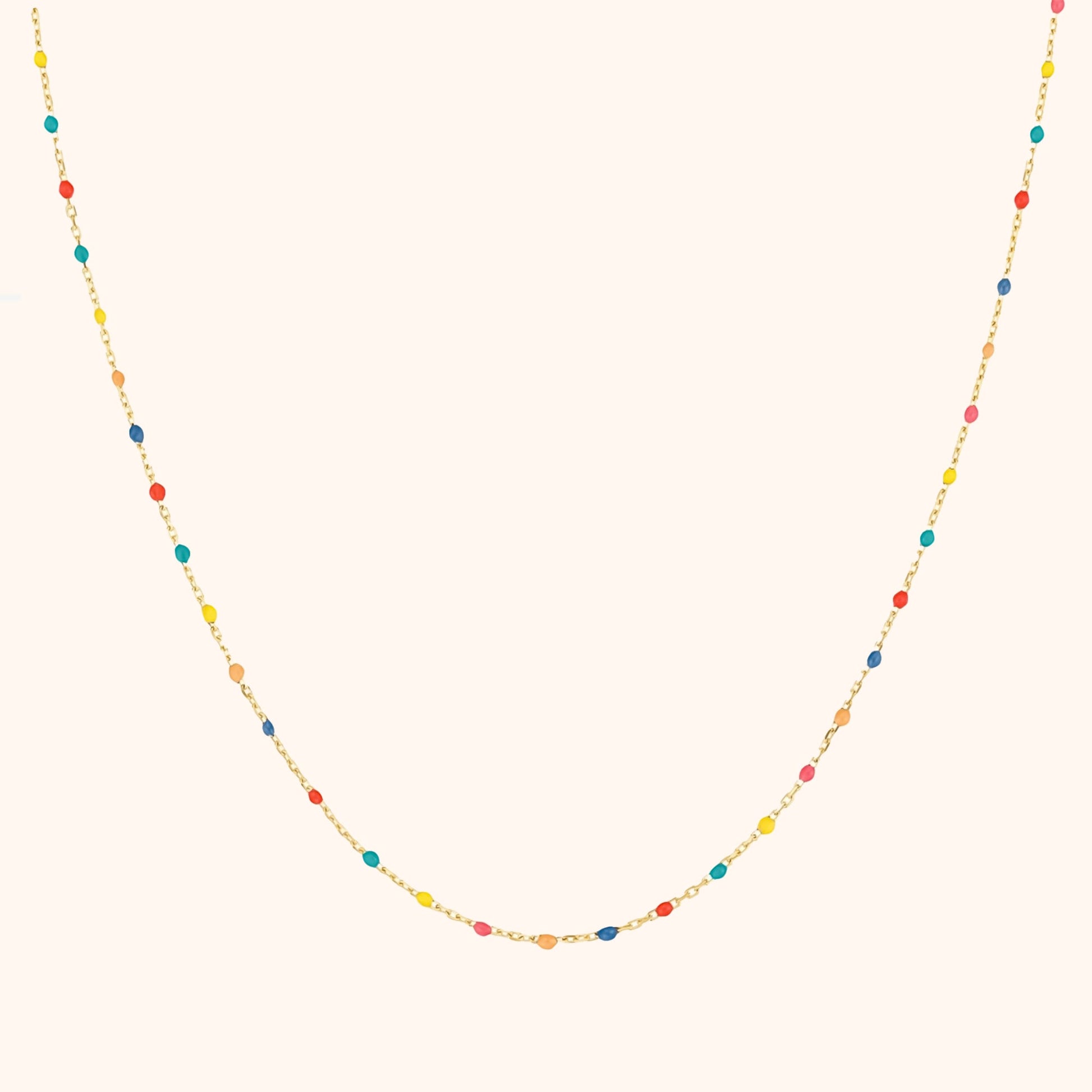 Goldene Halskette mit bunten Perlen, Damen Schmuck, modisches Accessoire, elegantes Design.