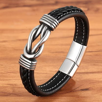 Schwarzes Lederarmband mit silbernem Knoten, Herrenmode, Edelstahlverschluss, elegant.