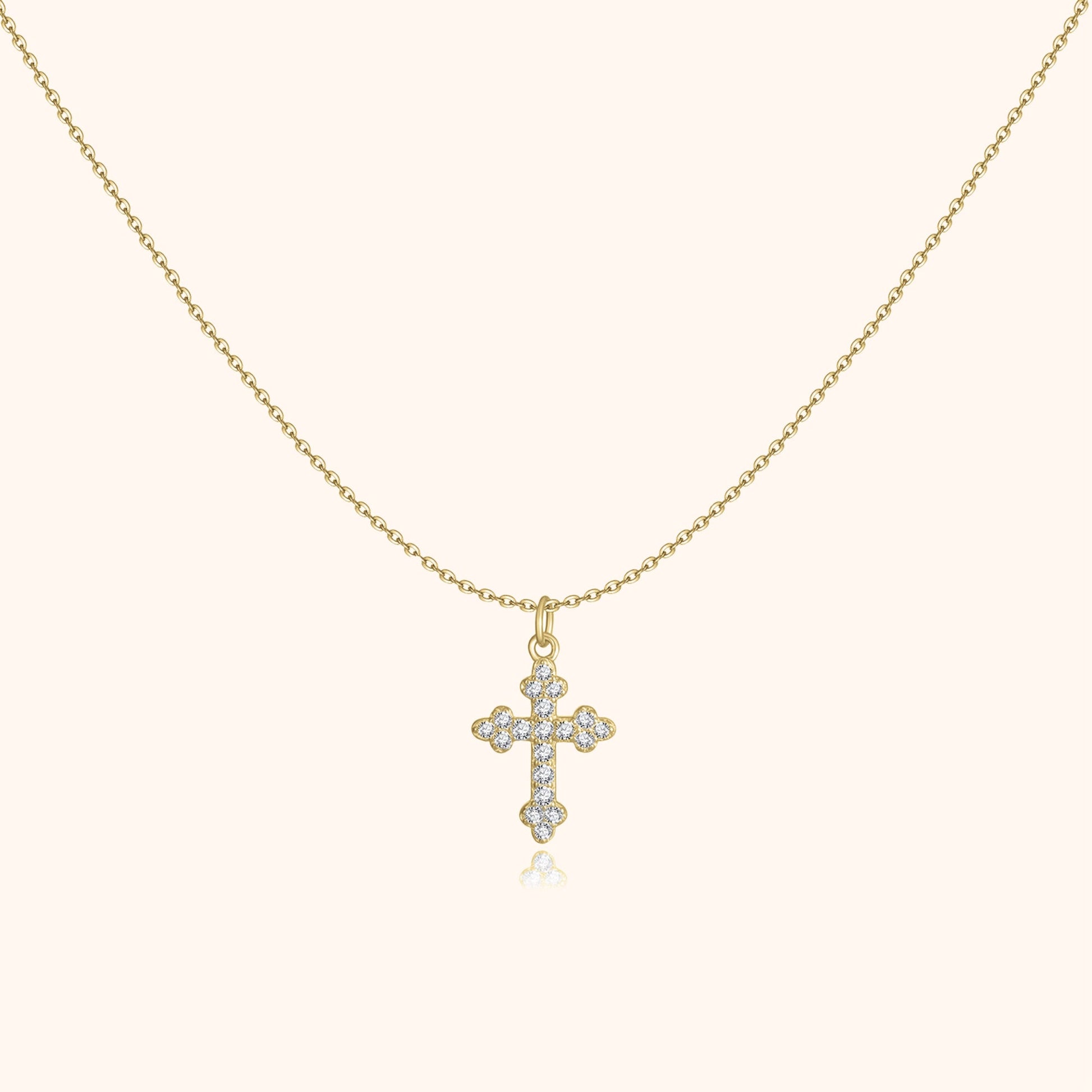 Goldene Halskette mit Kreuzanhänger, besetzt mit Diamanten, eleganter Schmuck für Damen.