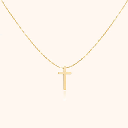 Goldene Kreuzkette, minimalistisches Design, eleganter Schmuck, religiöses Accessoire, Damenmode.
