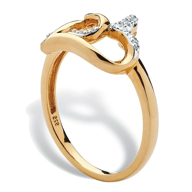 Goldener Damenring mit Diamanten, geschwungenes Design, eleganter Schmuck, 14 Karat Gold.