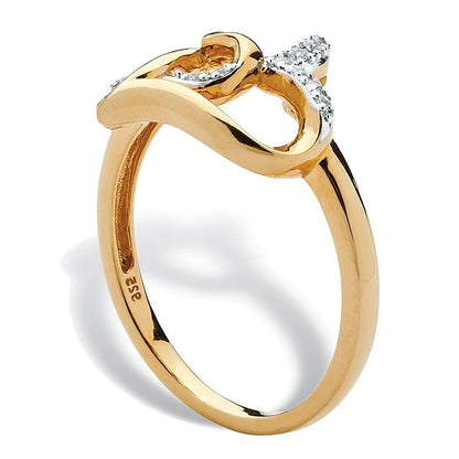 Goldener Damenring mit Diamanten, geschwungenes Design, eleganter Schmuck, 14 Karat Gold.