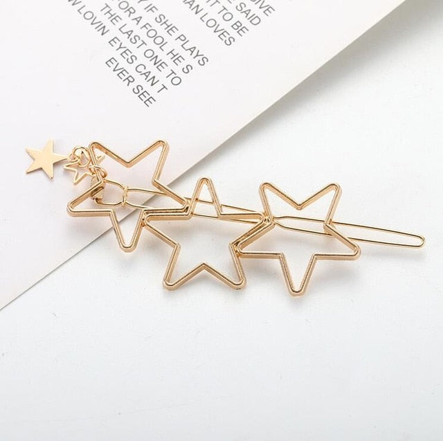 Goldene Haarspange mit Stern-Design, modisches Accessoire, eleganter Haarschmuck, Geschenkidee.
