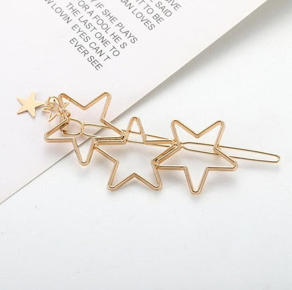 Goldene Haarspange mit Stern-Design, modisches Accessoire, eleganter Haarschmuck, Geschenkidee.